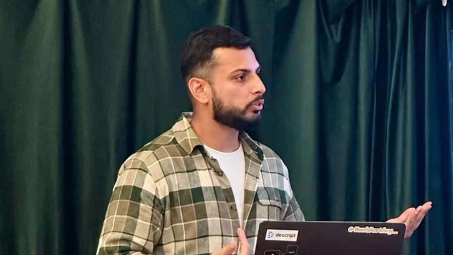Furquan presenting at a Hulm Club workshop in London